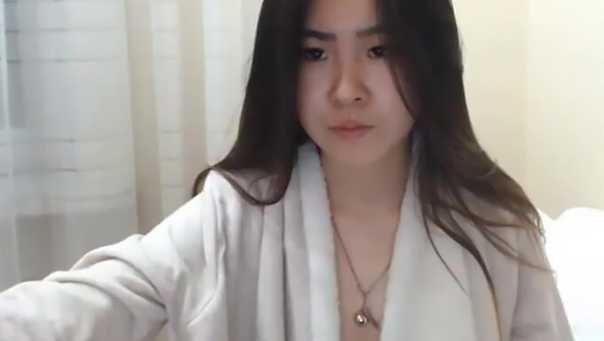 Seductive Asian Woman Ejaculates On Camera